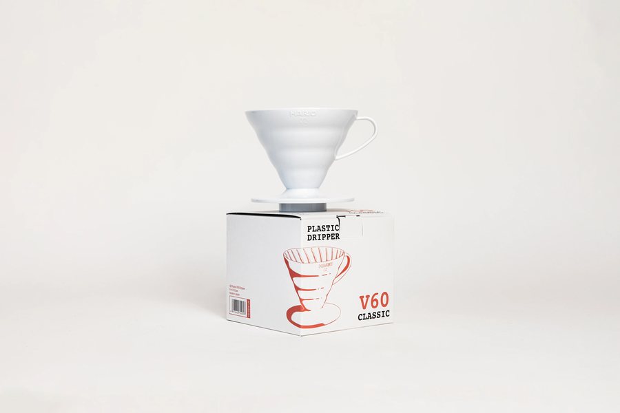 Hario V60 plastic dripper 02 in white, sitting on its box